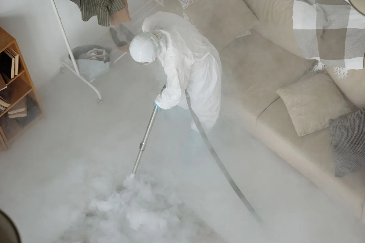 Biohazard cleanup technician in protective equipment, Lago Vista, TX